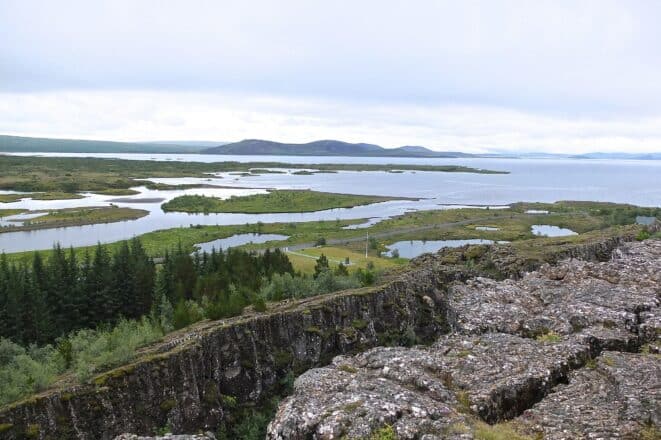 Almannagja Canyon in Thingvellir National Park with Lake Thingvallavatn in the background