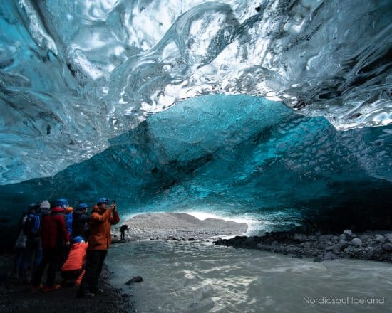 People exploring an ice cave at Vatnajokull National Park.