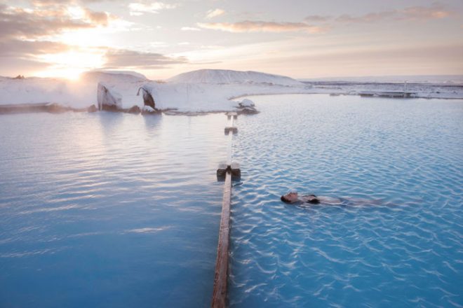 Person floating in the Myvatn Nature baths in the winter