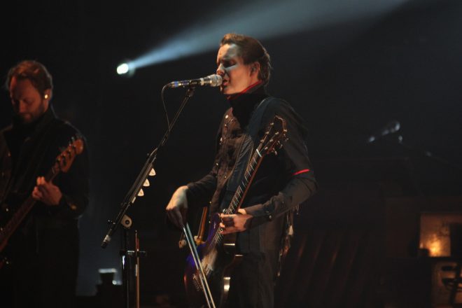 Jónsi, lead singer of Icelandic band Sigur Rós, performing on stage.