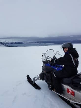 A girl on a snowmobile on top of Langjokull Glacier