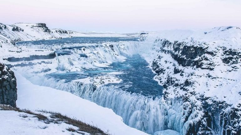 Golden Circle's Gullfoss Waterfall in the winter, surrounded by snow
