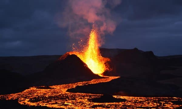 A caldera spewing lava in the night.