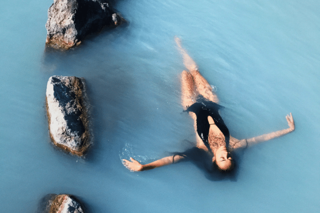 A woman floating on her back at Iceland's Blue Lagoon.