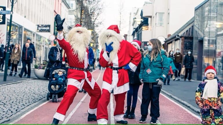 Two Yule Lads with children in Reykjavik