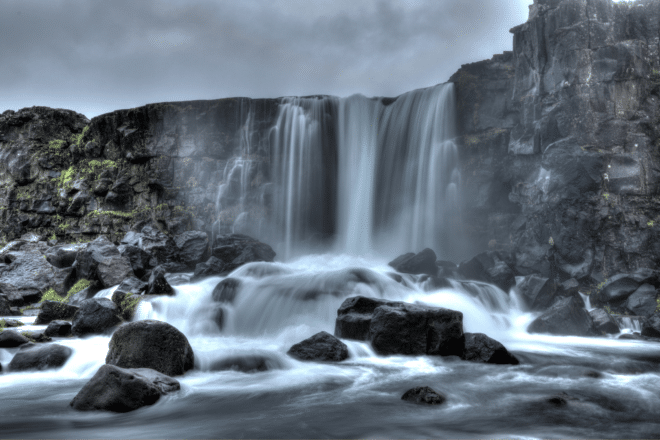 Öxarárfoss Waterfall in Iceland's Þingvellir National Park on the Golden Circle route on a cloudy day.