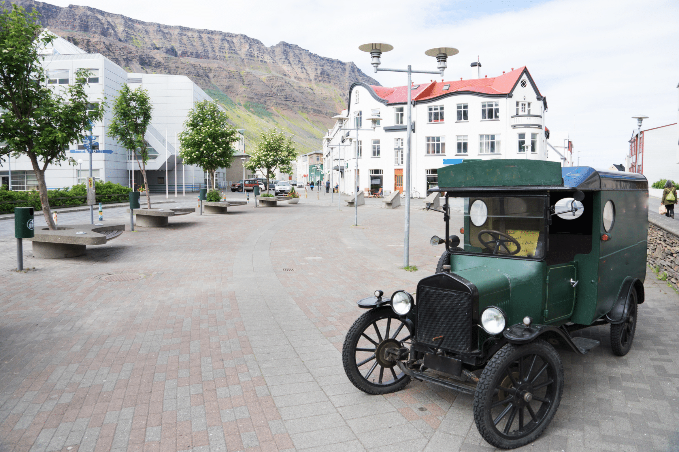 An old car on a quiet street in Isafjordur Town in the Westfjords of Iceland