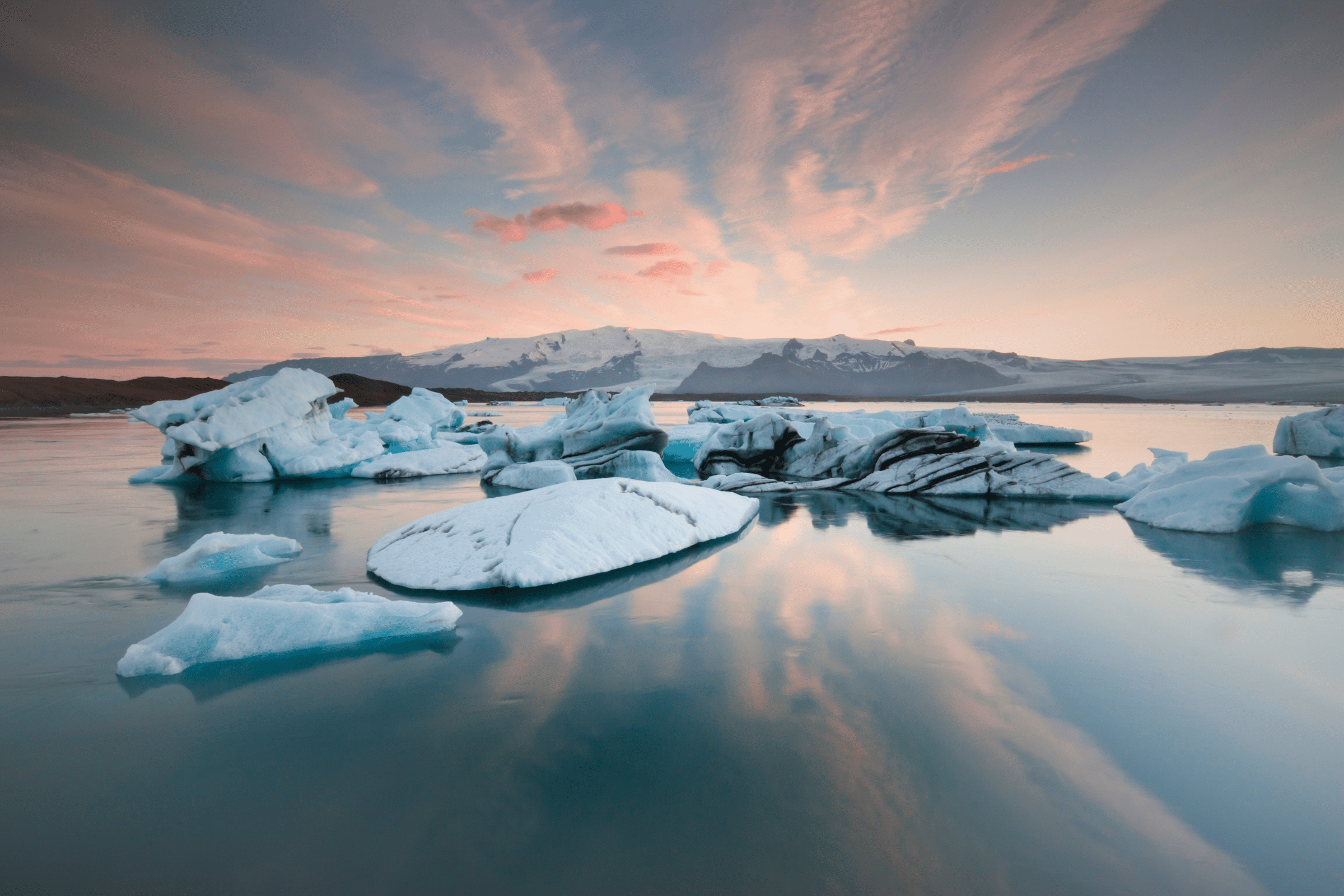 Pink skies over icebergs at Jokulsarlon Glacier Lagoon in southeast Iceland.