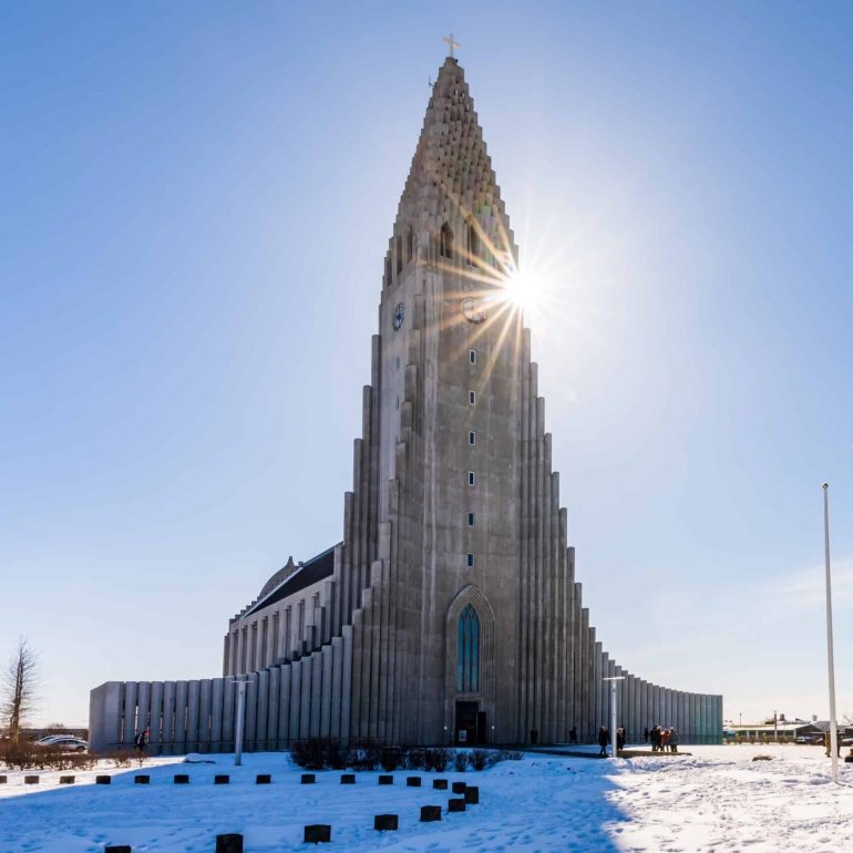 Hallgrimskirkja Cathedral in Reykjavik, Iceland, on a sunny winter day with a blue sky.