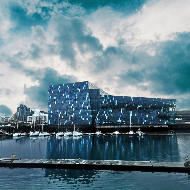 Sailboats in front of Harpa Concert Hall in Reykjavik, Iceland.